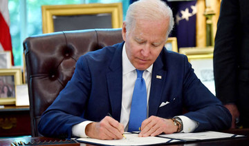 US President Joe Biden signs into law the Ukraine Democracy Defense Lend-Lease Act of 2022 on May 9, 2022. (AFP)