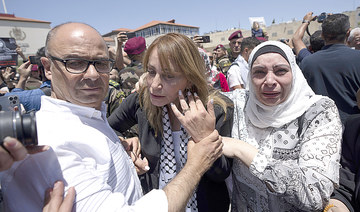 Palestinians honor slain journalist, reject joint probe