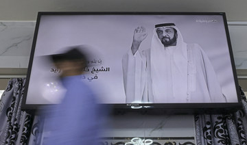 A local channel displays the portrait of late UAE's President Sheikh Khalifa bin Zayed Al-Nahyan in Abu Dhabi on May 13, 2022. (