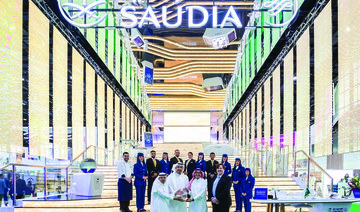 Saudi Arabian Airlines’ team members receive an award at ATM 2022.
