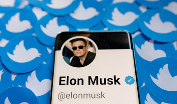 Elon Musk's Twitter profile is seen on a smartphone. (REUTERS)