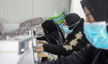 Women sew at the Jadaa rehabilitation camp for the displaced near the northern Iraqi city of Mosul, on May 11, 2022. (AFP)