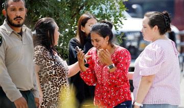 A woman reacts outside the Ssgt Willie de Leon Civic Center in Uvalde, Texas, U.S. May 24, 2022. (REUTERS)