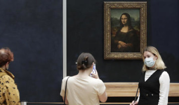 Man arrested after smearing Mona Lisa with cake at Louvre