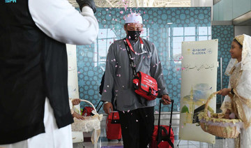The Indonesian pilgrims were presented flowers, dates and Zamzam water bottles upon arrival. (SPA)