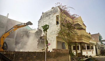 A bulldozer is being used to demolish the residence of Javed Ahmed in Allahabad on June 12, 2022. (AFP)