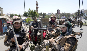 Taliban fighters guard at the site of an explosion in Kabul, Afghanistan, Saturday, June 18, 2022. (AP)