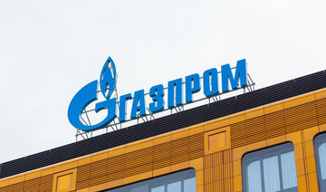 Volatile rouble slumps to 10-day low; Gazprom shares extend losses