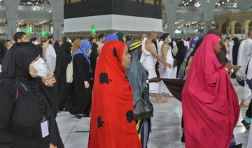 Women don colorful robes at guardian-free Hajj