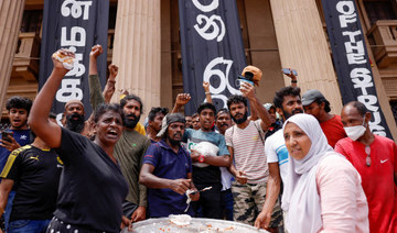 Demonstrators celebrate in Colombo after resignation of President Gotabaya Rajapaksa. (Reuters)