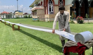 Kashmiri calligrapher’s 500-meter Qur’an sets record amid hopes for Middle East visit