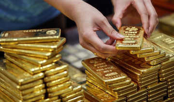 Gold drops below $1,700 on stronger dollar, rate-hike bets