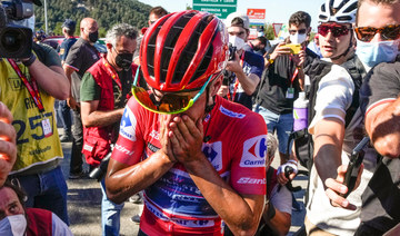 Tearful Evenepoel set to win Vuelta after protecting lead