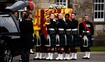 Queen Elizabeth II’s coffin arrives in Edinburgh as mourners line streets