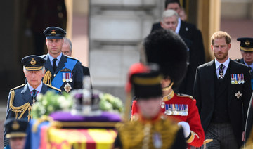 King Charles, William and Harry walk together behind queen’s coffin