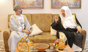Dr. Abdullah bin Mohammed Al-Asheikh meets with Khalid bin Hilal bin Nasser Al-Maawali in Muscat. (SPA)