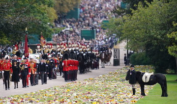 Mourners lining streets for Queen Elizabeth’s funeral share thoughts about her and future of the monarchy