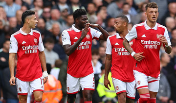 Arsenal beats 10-man Tottenham 3-1 to stay atop EPL table