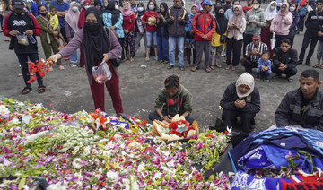 Fans mourn victims of Indonesian stadium stampede at Friday prayers
