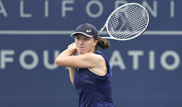 Top-ranked Swiatek advances with three-set victory in San Diego Open