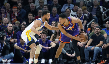 Booker sparks Suns over Warriors as Thompson ejected