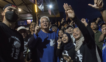 Malaysia in ‘uncharted territory’ as voters head to polls in tight election race