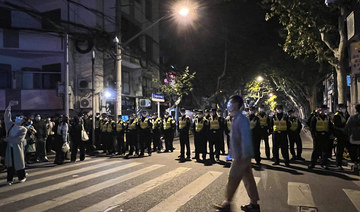 Police detain two people at Shanghai protest site