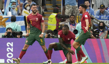 Fernandes double sends Portugal into World Cup knock-outs