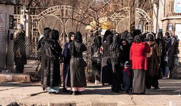 Afghan women weep as Taliban fighters enforce university ban