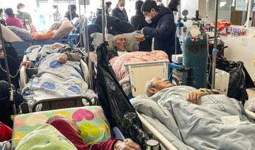 Patients on stretchers are seen at Tongren hospital in Shanghai on January 3, 2023. (AFP) 