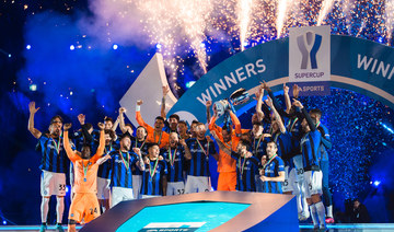 Inter's players celebrate after winning the Italian Super Cup football match between AC Milan and Inter Milan.
