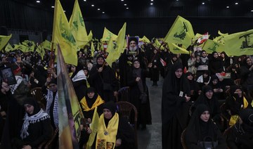 Supporters of Hezbollah attend a speech by the group’s leader Hassan Nasrallah in Beirut’s southern suburbs. (File/AFP)