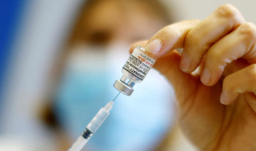 A medical worker prepares a dose of the "Cominarty" Pfizer-Bivalent coronavirus disease (COVID-19) vaccine. (REUTERS)