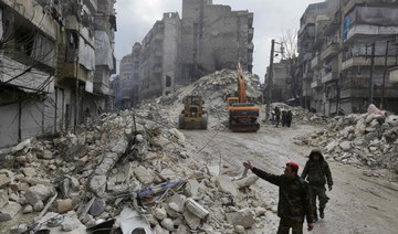 Syrian rescue teams search for victims and survivors in the city of Hama on February 6, 2023. (AFP)