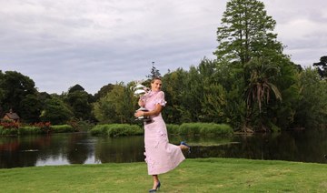 Belarus’ Aryna Sabalenka poses with the 2023 Australian Open winner's trophy in Royal Botanic Garden in Melbourne. (AFP)