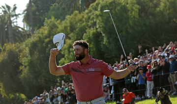 Rahm holds on to win at Riviera and return to No. 1 in world
