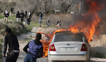 Rampaging Israeli settlers set fire to homes and cars in West Bank