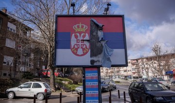 A torn poster depicting the Serbian National flag is pictured in the northern part of Mitrovica, Kosovo.