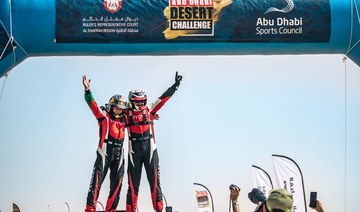 Saudi's Yazeed Al-Rajhi and German partner Timo Gottschalk celebrate winning the Abu Dhabi Desert Challenge.