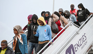 Ivorian migrants disembark a repatriation plane from Tunisia at Felix Houphouet Boigny airport in Abidjan, on March 04, 2023. 