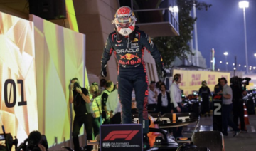 Red Bull Racing’s Dutch driver Max Verstappen reacts as he exits his car after winning the Bahrain Formula One Grand Prix.