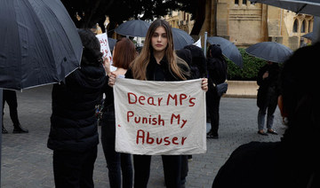 US-Lebanese model Nour Arida (C) join activists and survivors in front of the Lebanese parliament, in Beirut. (File/AFP)