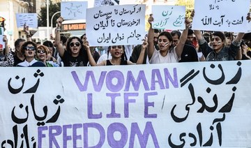 Iranians living in Greece chant slogans and hold placards during a demonstration, following the death in Tehran of Mahsa Amini. 