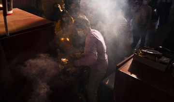 Hong Kong’s ‘villain hitting’ ritual draws crowds