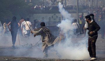 Pakistan police halt bid to arrest ex-PM Khan after clashes