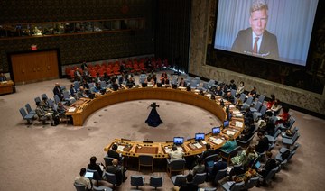United Nations special envoy for Yemen Hans Grundberg (R) is displayed on a screen as he attends a Security Council meeting.