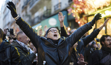 Protesters chant slogans in Paris, Sunday, March 19, 2023. (AP)