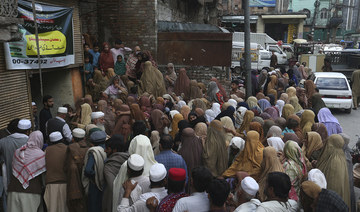 One person dies in stampede for free flour as Ramadan begins in Pakistan