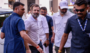 India's Congress party leader Rahul Gandhi, second left, arrives at the district court in Surat on March 23, 2023. (AFP)
