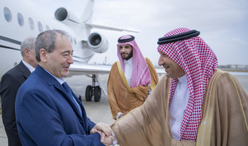 Saudi Arabia’s Deputy Foreign Minister Waleed Al-Khuraiji receives Syrian Foreign Minister Faisal Mekdad at Jeddah airport.